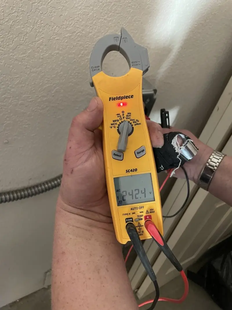 Voltage testing with clamp meter during Whole House Surge Protector in Erie